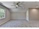 Neutral bedroom with a ceiling fan, carpeting, recessed lighting, and a bright window at 5567 Stapleton Dr, Dunwoody, GA 30338
