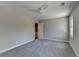 Spacious bedroom with neutral walls, plush carpet and modern ceiling fan at 5567 Stapleton Dr, Dunwoody, GA 30338