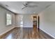 Spacious bedroom with hardwood floors, a ceiling fan, and plenty of natural light at 5567 Stapleton Dr, Dunwoody, GA 30338