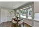 Cozy breakfast nook features bay window, hardwood floors and seating for four at 5567 Stapleton Dr, Dunwoody, GA 30338