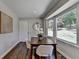 Light filled breakfast nook with beautiful backyard views and modern decor at 5567 Stapleton Dr, Dunwoody, GA 30338