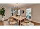 Dining room with modern light fixture, and doorway to the back patio at 5567 Stapleton Dr, Dunwoody, GA 30338