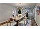 Dining room with modern light fixture, and doorway to the stairway at 5567 Stapleton Dr, Dunwoody, GA 30338