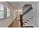 Spacious entryway with hardwood floors, staircase, and natural light at 5567 Stapleton Dr, Dunwoody, GA 30338