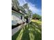 Elegant white house features a welcoming porch and manicured landscaping at 5567 Stapleton Dr, Dunwoody, GA 30338