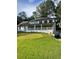 Desirable home with a wide front porch and large well manicured front lawn at 5567 Stapleton Dr, Dunwoody, GA 30338