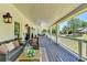 Inviting front porch featuring sitting area and porch swing at 5567 Stapleton Dr, Dunwoody, GA 30338