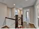 Hallway with wood floors, wood and white railing, and multiple doorways at 5567 Stapleton Dr, Dunwoody, GA 30338