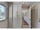 Entryway with built-in storage cabinets, hardwood floors, and natural light from a window by the door at 5567 Stapleton Dr, Dunwoody, GA 30338