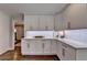 Bright kitchen with white cabinets, countertops, and stainless steel appliances at 5567 Stapleton Dr, Dunwoody, GA 30338