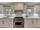 Well-equipped kitchen with stainless steel appliances, quartz countertops, and ample cabinet space for storage at 5567 Stapleton Dr, Dunwoody, GA 30338