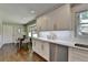 Bright kitchen with white cabinetry, stainless steel appliances, and quartz countertops, a chef's delight at 5567 Stapleton Dr, Dunwoody, GA 30338