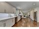 Open concept kitchen with stainless appliances and view to the living room at 5567 Stapleton Dr, Dunwoody, GA 30338