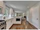 Open concept kitchen with stainless steel appliances and hardwood flooring at 5567 Stapleton Dr, Dunwoody, GA 30338