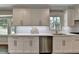 Updated kitchen features white cabinets, quartz countertops and stainless steel appliances at 5567 Stapleton Dr, Dunwoody, GA 30338
