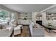 Spacious living room featuring fireplace, built-ins, and comfortable seating at 5567 Stapleton Dr, Dunwoody, GA 30338