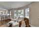 Bright living room area with breakfast nook and large windows overlooking backyard at 5567 Stapleton Dr, Dunwoody, GA 30338