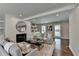 Bright living room featuring fireplace, built-ins, and hardwood floors at 5567 Stapleton Dr, Dunwoody, GA 30338