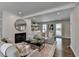 Spacious living room with fireplace, hardwood floors, and natural light at 5567 Stapleton Dr, Dunwoody, GA 30338