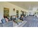 Inviting covered porch with a porch swing and cozy seating, great for enjoying the outdoors in comfort and style at 5567 Stapleton Dr, Dunwoody, GA 30338