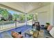 Relaxing covered porch with comfortable seating and a serene view, perfect for enjoying peaceful outdoor moments at 5567 Stapleton Dr, Dunwoody, GA 30338