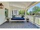 Charming porch swing, ideal for relaxing outdoors, and classic details creating a cozy and inviting atmosphere at 5567 Stapleton Dr, Dunwoody, GA 30338
