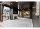 Covered back porch with brick fireplace, ceiling fan, and outdoor living space at 56 Pine St, Roswell, GA 30075