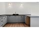 Home wet bar with granite countertop, modern cabinetry and fixtures is ready for entertaining at 56 Pine St, Roswell, GA 30075