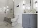 Modern bathroom with a glass-enclosed shower, marble sink, and white tile at 56 Pine St, Roswell, GA 30075