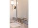 Close-up of a modern bathroom vanity featuring marble countertops and a large mirror at 56 Pine St, Roswell, GA 30075