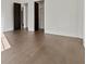 A simple, minimalist bedroom with dark colored doors and hardwood floors at 56 Pine St, Roswell, GA 30075