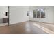 Sun-filled bedroom with gleaming hardwood floors and expansive windows at 56 Pine St, Roswell, GA 30075