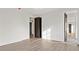 Bedroom featuring hardwood floors and white walls offering a modern and minimalist design at 56 Pine St, Roswell, GA 30075