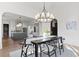 Chic dining room with modern chandelier, hardwood flooring, and access to other rooms at 56 Pine St, Roswell, GA 30075