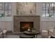 Modern fireplace with marble surround and custom built-ins at 56 Pine St, Roswell, GA 30075