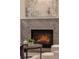 Close up of marble fireplace with decor at 56 Pine St, Roswell, GA 30075