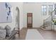 Bright foyer with hardwood floors, high ceilings, and a staircase with an iron railing at 56 Pine St, Roswell, GA 30075