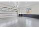 Spacious two-car garage with epoxy flooring, white walls, and ample lighting at 56 Pine St, Roswell, GA 30075