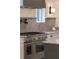 Close-up of the gourmet stainless steel range and granite counters at 56 Pine St, Roswell, GA 30075