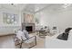 Bright living room with fireplace, built-in cabinets, and ample seating at 56 Pine St, Roswell, GA 30075