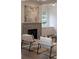 Living room featuring a fireplace, built-in cabinets, and contemporary artwork at 56 Pine St, Roswell, GA 30075