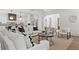 Open-concept living room with hardwood floors, and a view of kitchen area at 56 Pine St, Roswell, GA 30075