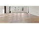 Bright and airy living room featuring hardwood floors and windows flooding the area with natural light at 56 Pine St, Roswell, GA 30075