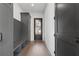 Mud room with built-in storage, bench seating, and hardwood floors at 56 Pine St, Roswell, GA 30075