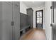 Mud room with built-in storage cabinets, bench seating, and hardwood floors at 56 Pine St, Roswell, GA 30075
