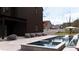 Backyard pool and patio area with lush landscaping, ideal for outdoor entertaining at 56 Pine St, Roswell, GA 30075