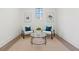 Cozy sitting area featuring neutral decor, plush chairs, and a glass table at 56 Pine St, Roswell, GA 30075