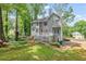 Expansive backyard with well-maintained lawn, patio, and mature trees at 959 Vendue Dr, Lawrenceville, GA 30044