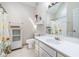 Bathroom with white vanity, tile floor, and shower with sunflower curtain at 959 Vendue Dr, Lawrenceville, GA 30044