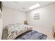 Simple bedroom with a colorful handmade quilt on the bed and a blue rug at 959 Vendue Dr, Lawrenceville, GA 30044